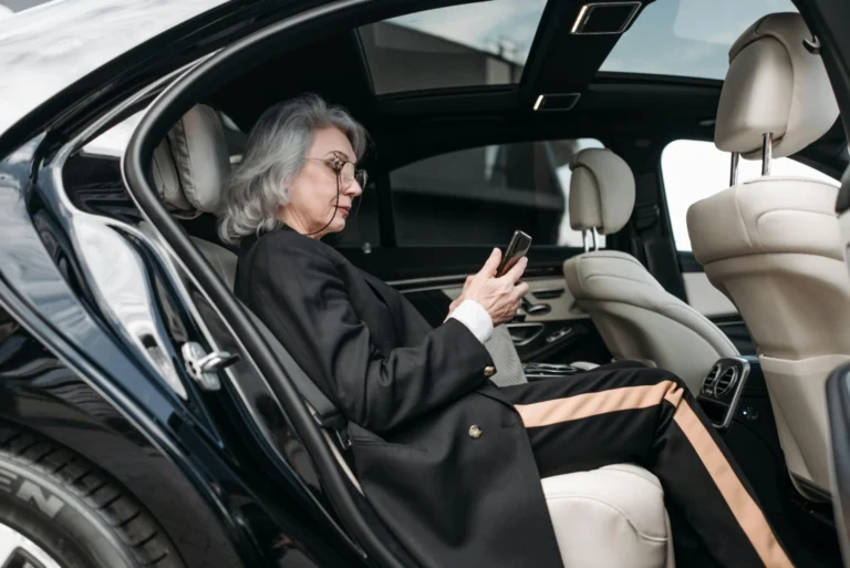 Hourly Limo services in luxury car using a smartphone